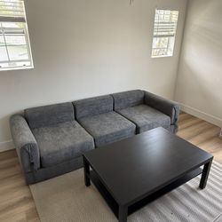 GRAY COUCH W/ PULL OUT FEATURE