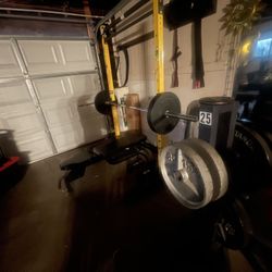 GARAGE WEIGHT LIFTING SETUP. BARBELL WEIGHTS BENCH RACK