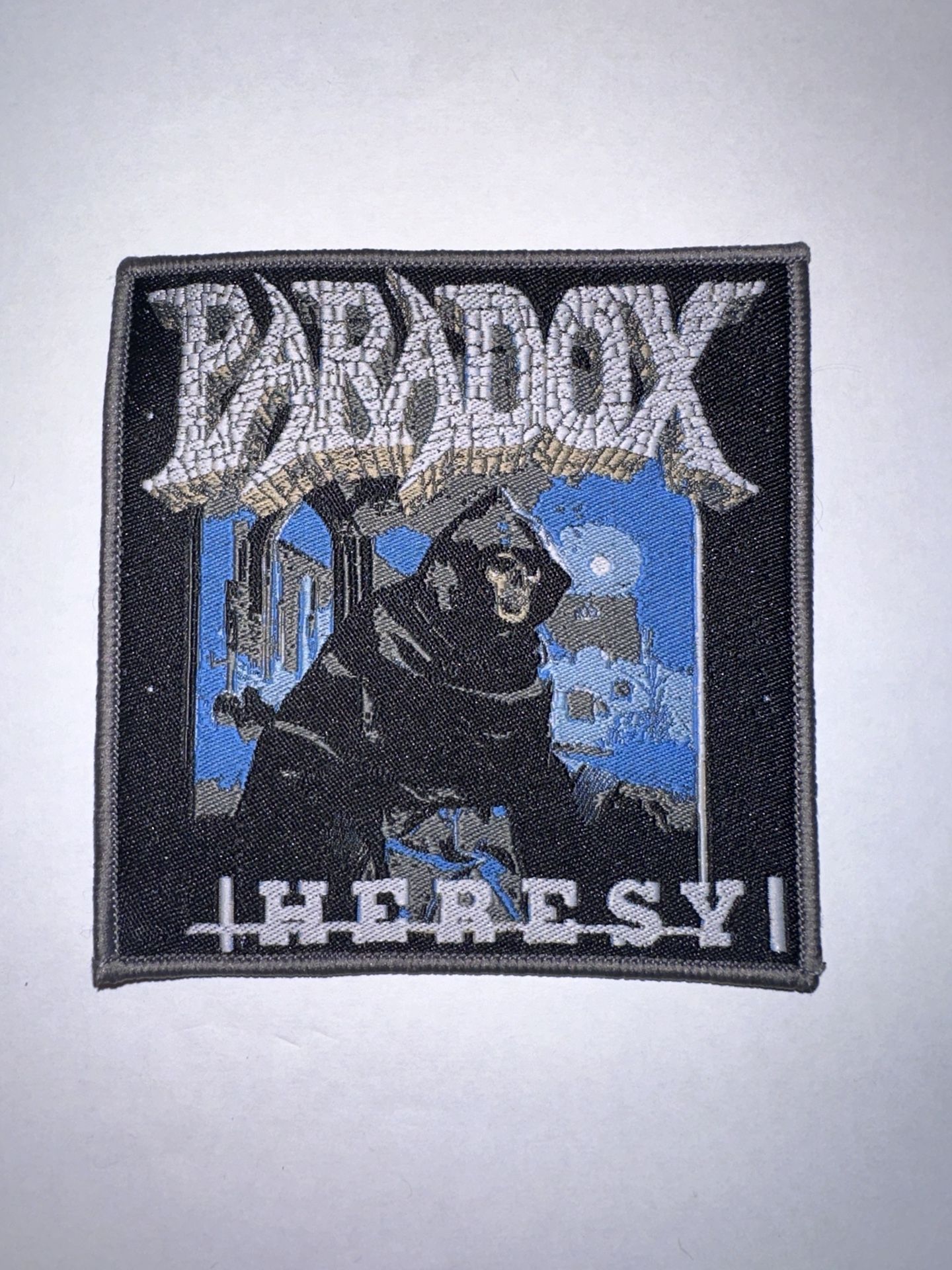 PARADOX, HERESY, SEW ON GRAY BORDER WOVEN PATCH