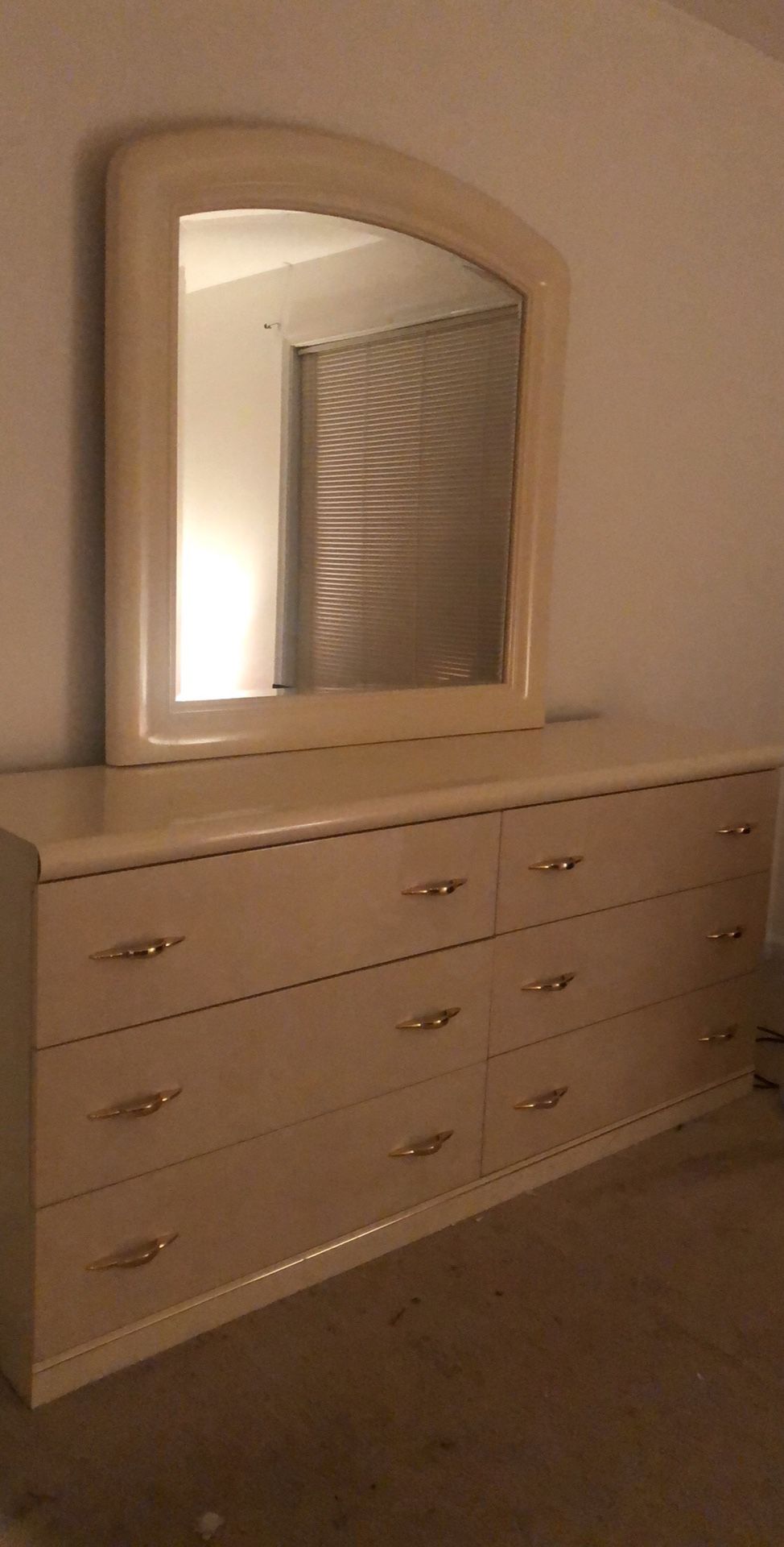 Dresser table with mirror and bed headboard