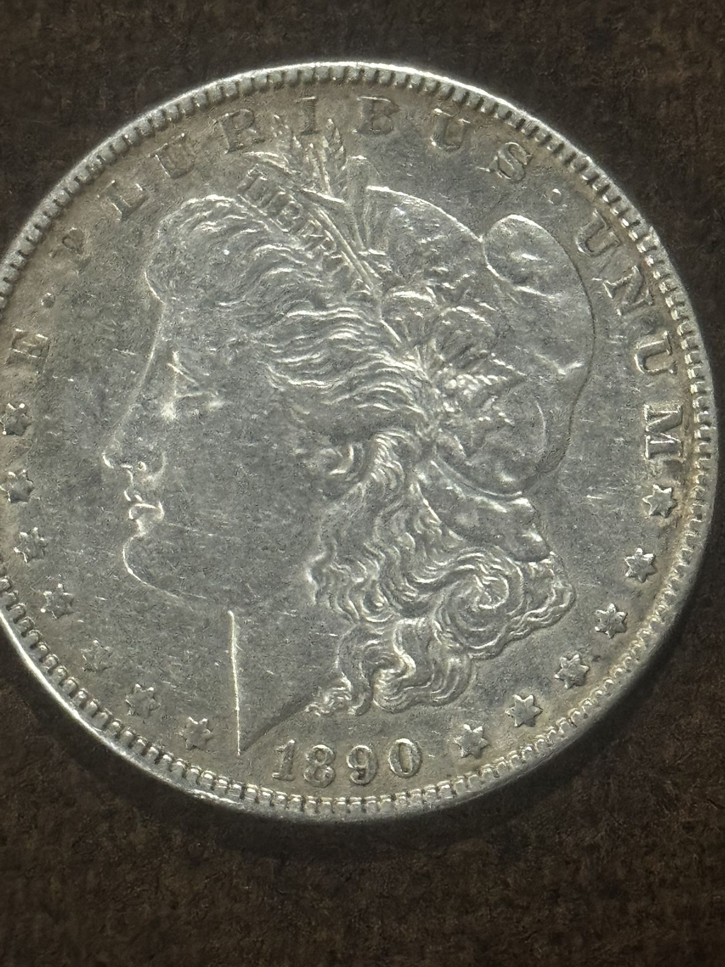 This is an 1890 Morgan Silver Dollar.