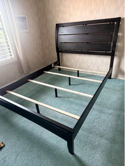 Brown wood queen bed frame
