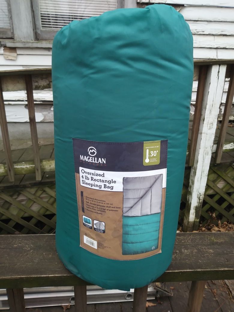 (Magellan Outdoors) 30° 4lb rectangle sleeping bag. 80in × 40in. Soft, durable polyester shell and liner. "Machine washable"
