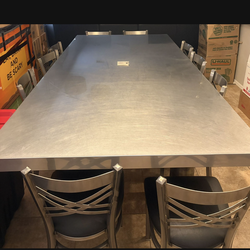 Stainless steel dining table with 10 chairs