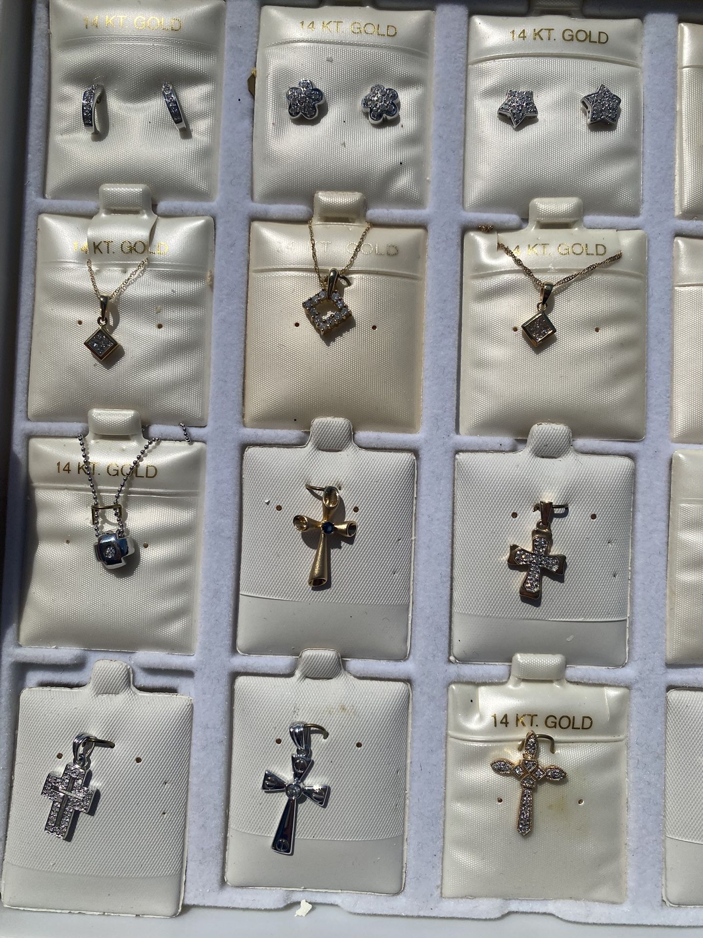 New 14 karat gold and diamond crosses