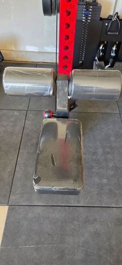Rack-mounted lat pulldown seat and knee roller attachment.