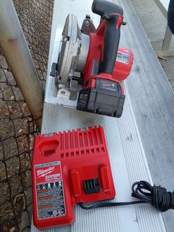 Milwaukee m18 circular saw battery 5.0 and charger $200