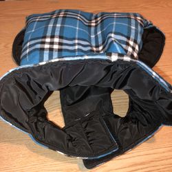 Size XL turquoise, white, and black reversible dog jacket. Tried on (too small) then washed so it’s in nearly new condition