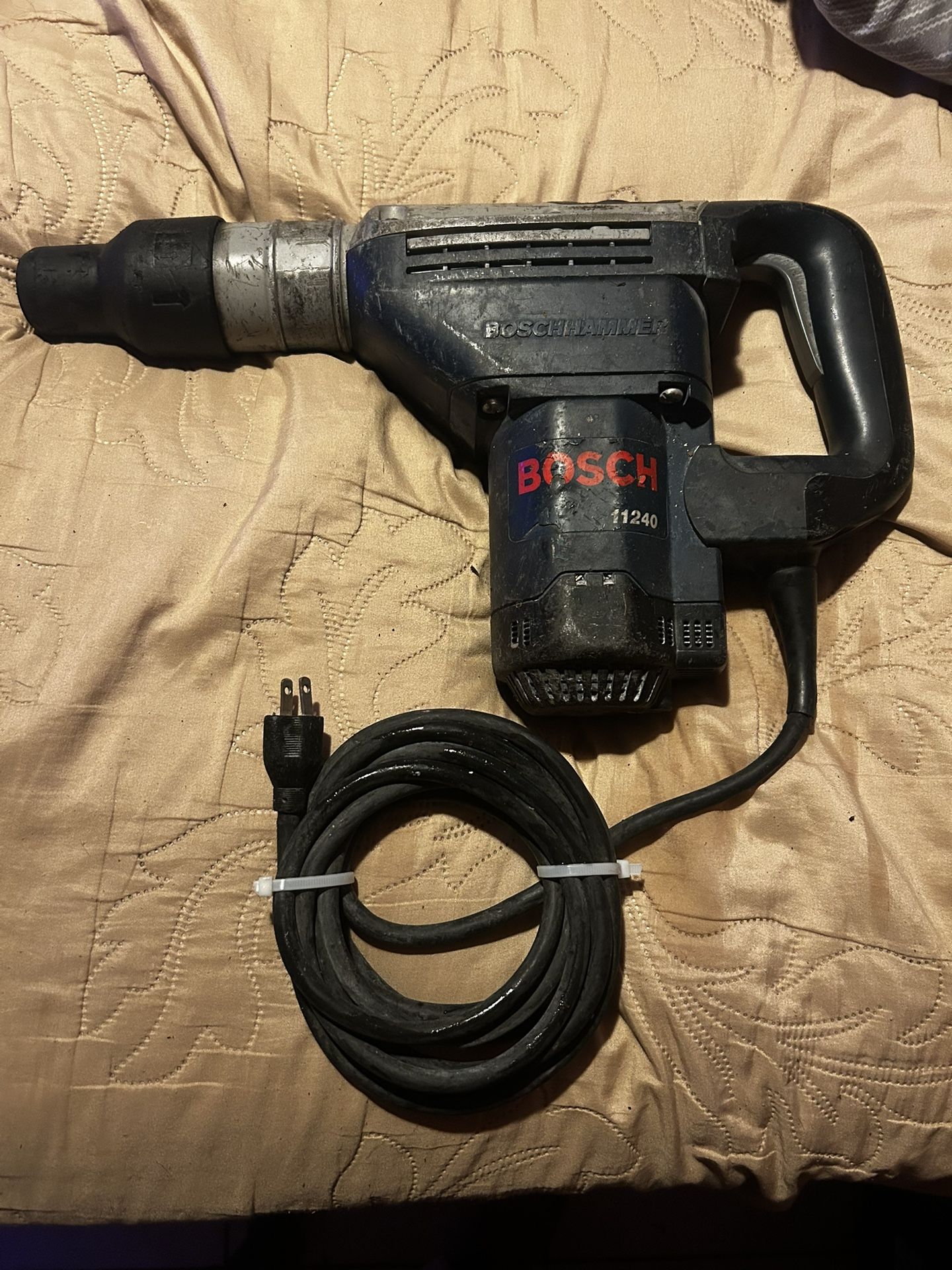 Bosch 11240 SDS-Max Combination Hammer, also known as a rotary hammer drill.