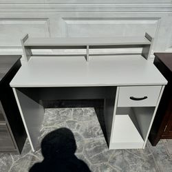 Modern wooden computer / writing / student desk w/hutch. excellent condition measurements:  20 deep x 42 1/2 L x 30 H (38 hutch). 