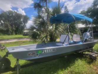 14' flats boat with 9.9 Evinrude outboard