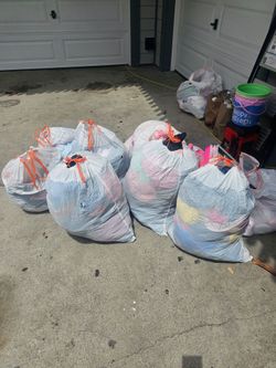 Bags of clothes boy, girl, and adult.