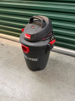 Electric Shop-Vac (5 gal I believe) with vac hose