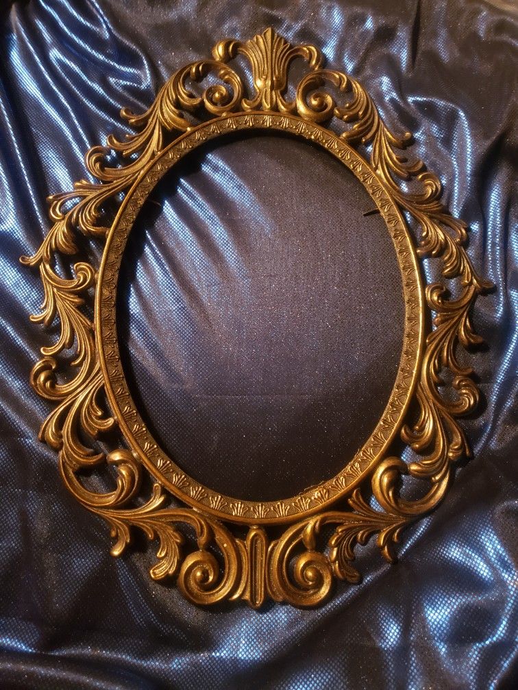 Vintage brass regency style oval frame