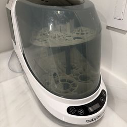 Baby Brezza Bottle Washer Pro with extra detergent tablets and descaling tablets