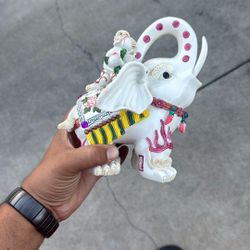 vintage porcelain figurine of an elephant with a monkey on its back