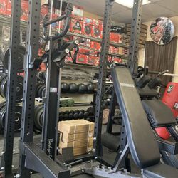 Half Rack with Extension, Lat Pull Down, Bench,  and Rower attachment 