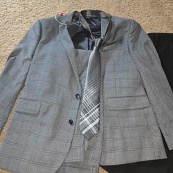 One Blazer and one Blazer with suit pants and a tie