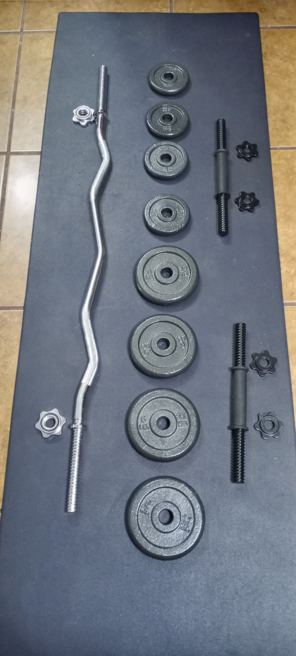 40 LBS.ADJUSTABLE CAST IRON DUMBBELL SET .PLUS CURL BAR. BRAND NEW IN BOX