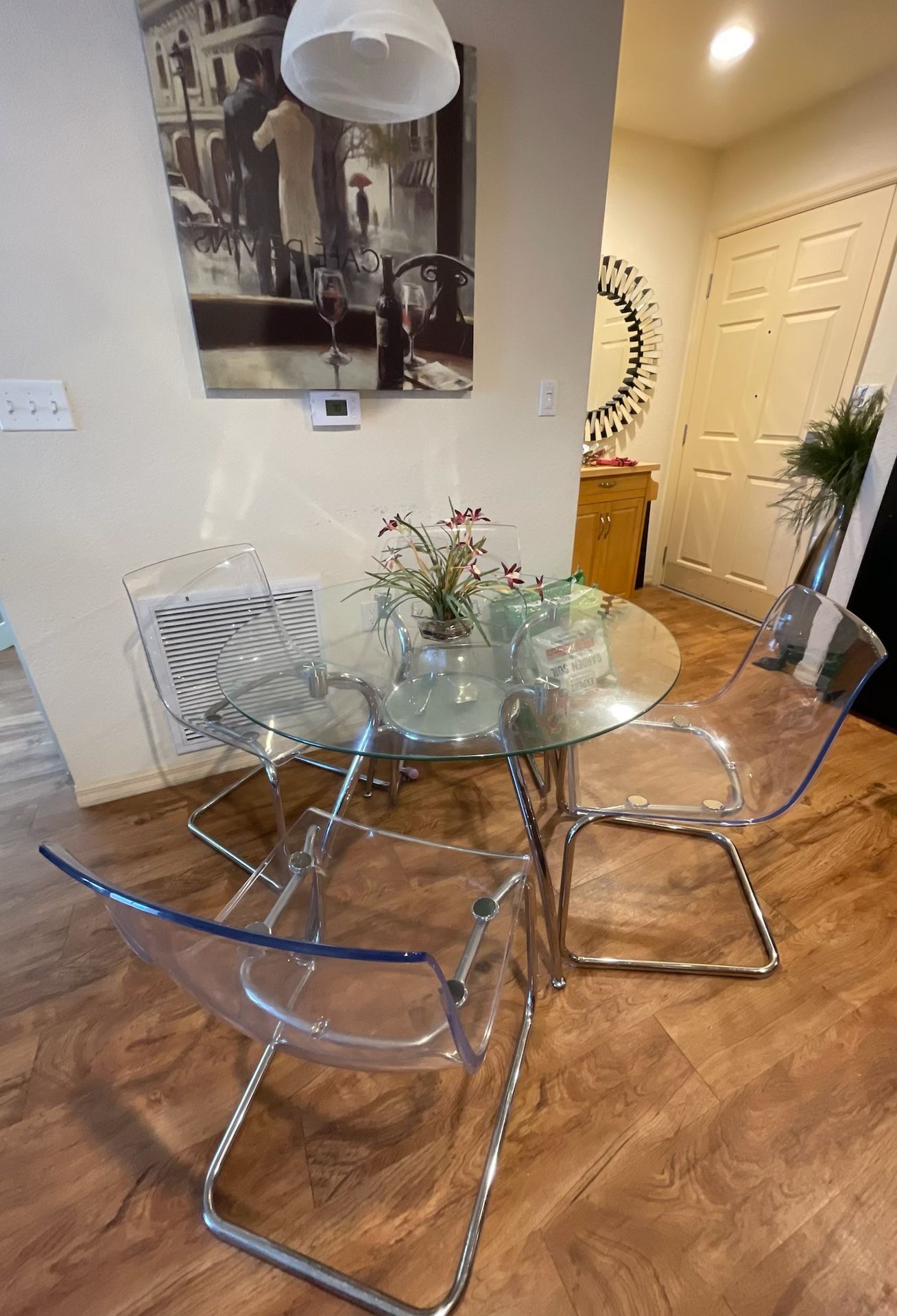 St. Paul Round Chrome Tempered Glass Dining Table by Porch & Den