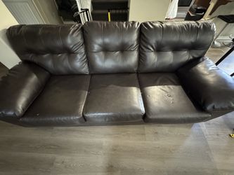 Black leather couch - good condition, must go!