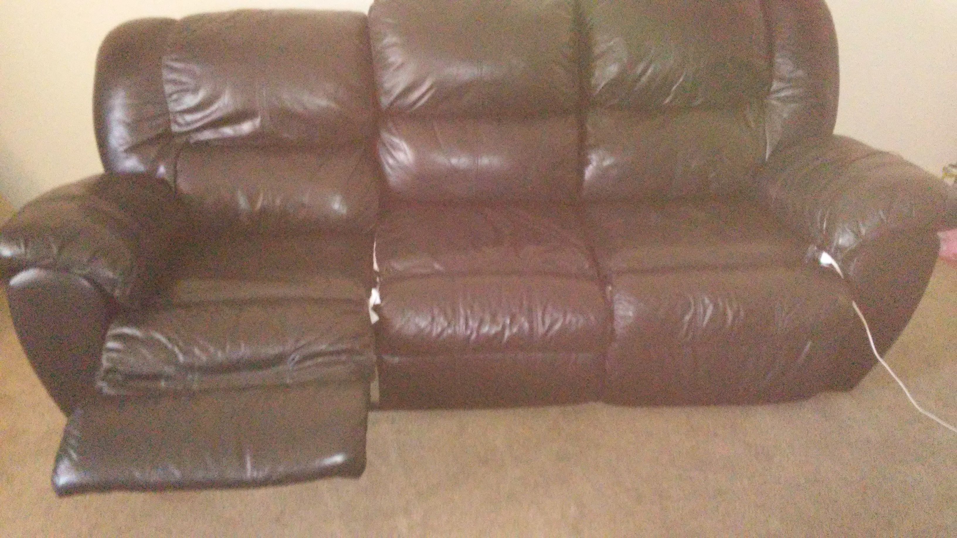 Used black leather couch, new with tag fishing pole, used tackle box and 32 inch tv