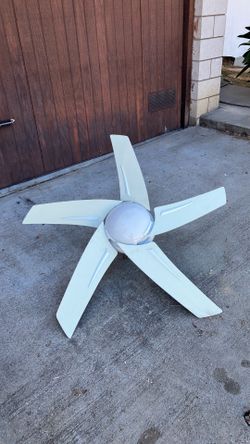 Modern looking five blade ceiling fan with light and fan support attachment