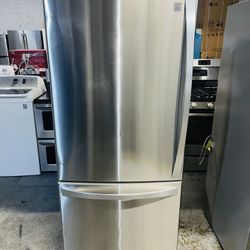 Kenmore stainless steel refrigerator, 30x67x28 inches, with a receipt for a 60-day warranty