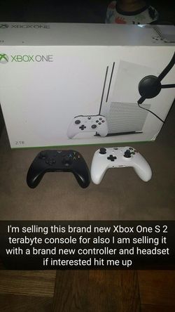 Xbox one s 2 terabyte two controllers and a head set.