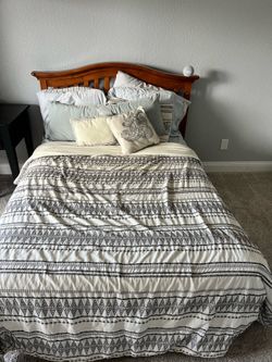 Full size bed with wooden headboard $100