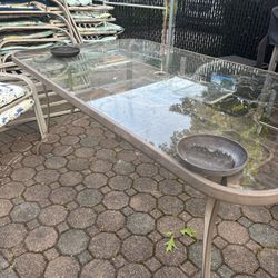 Outdoor Glass Table 6 Adjustable Chairs , With Cushions , Must Go Moving ASAP 