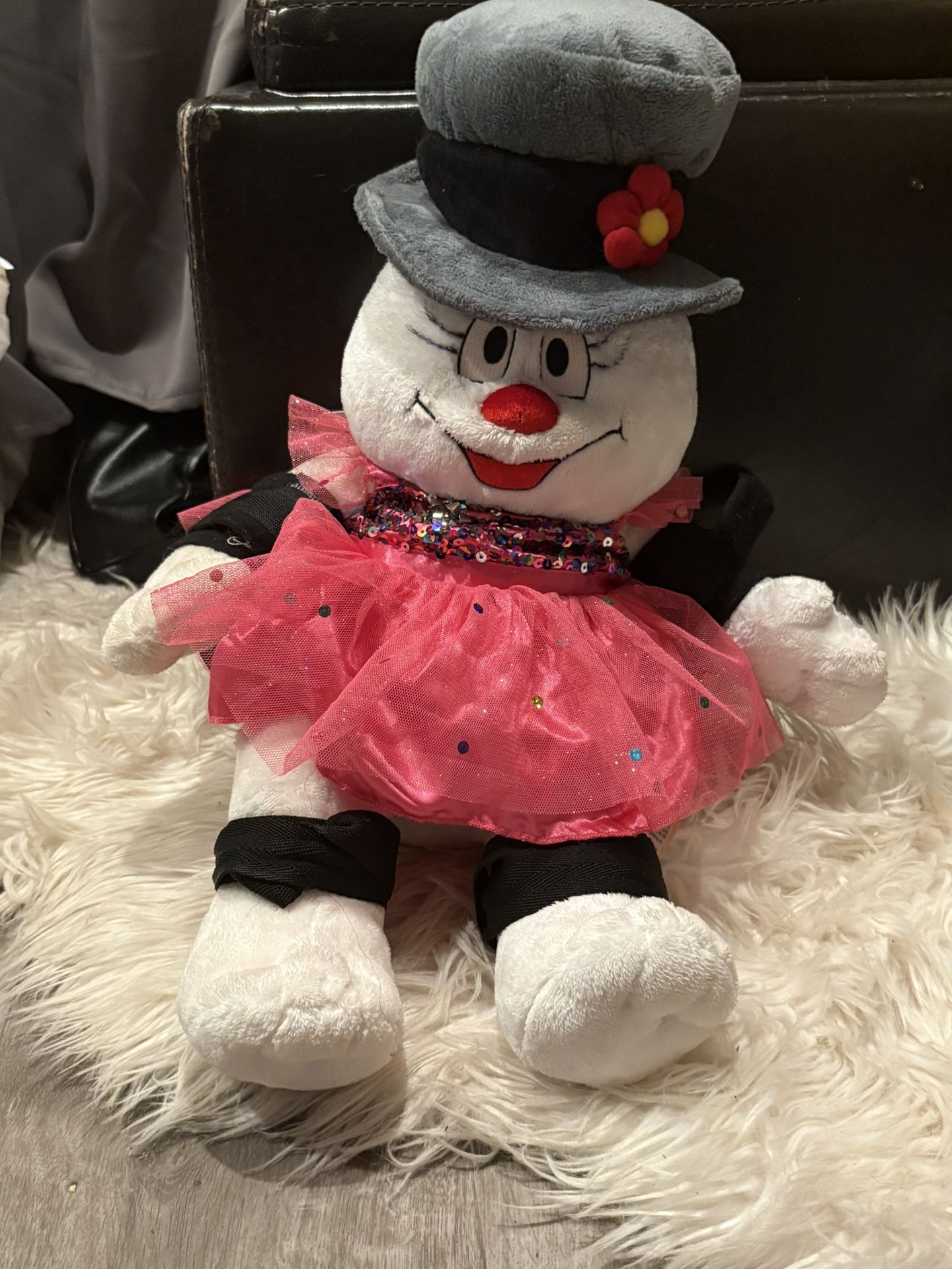 Frosty the Snowman plush wearing a dress stuffed animal