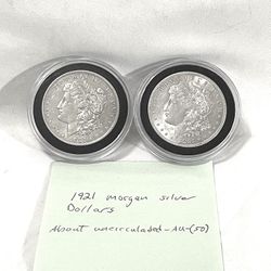 About Uncirculated-AU(50)  1921 Morgan Silver Dollars. These are valued at $91 each on US coin book.