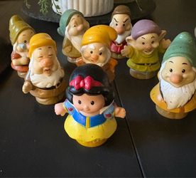 Fisher-Price Little People figurines featuring Snow White and the Seven Dwarfs