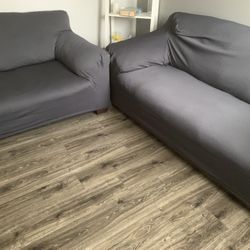 Black Sofa And Loveseat With Grey Covers