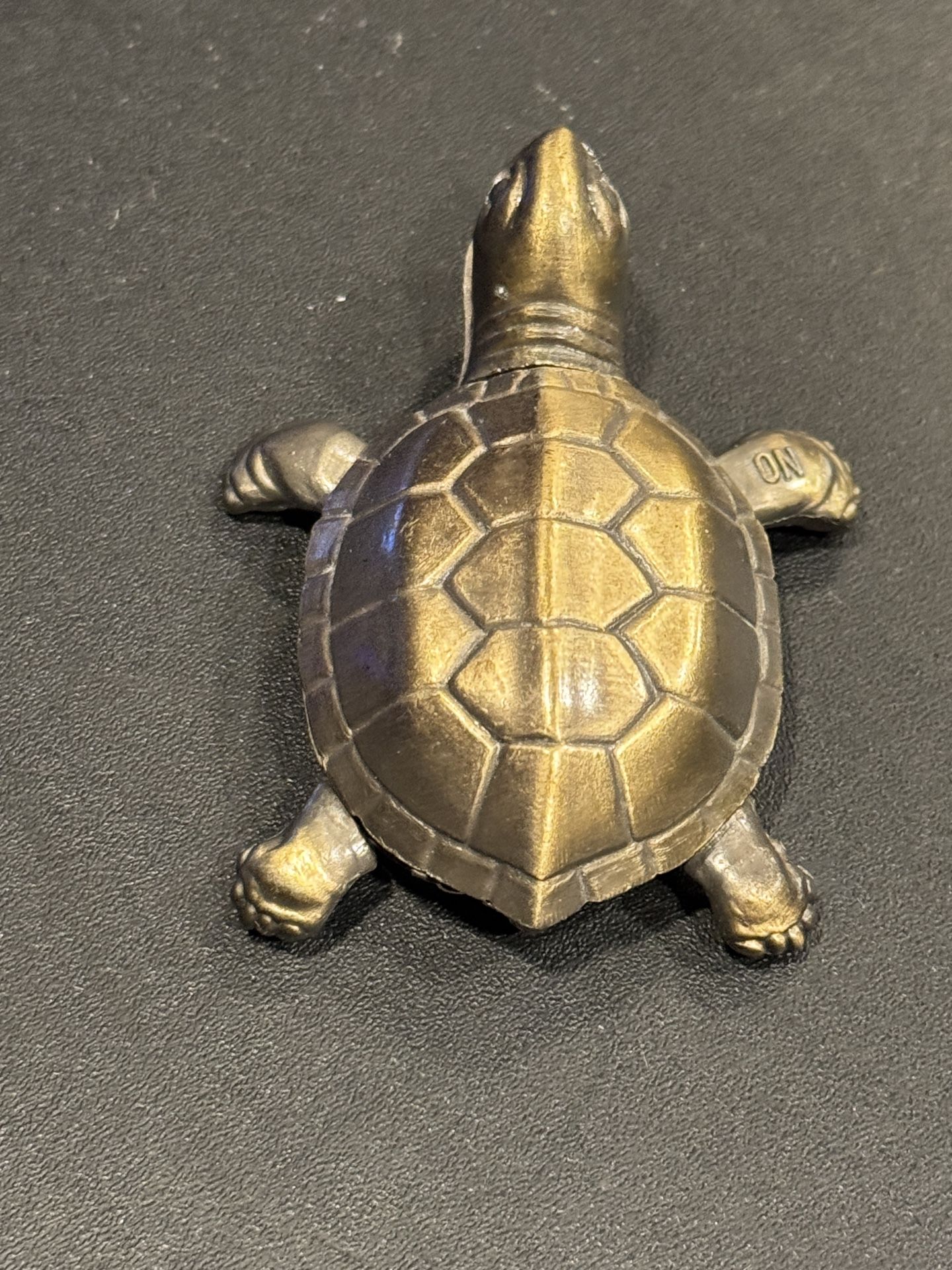Turtle lighter, butane. Works well