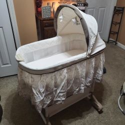 Delta Children Rocking Bedside Bassinet - Portable Crib with Lights Sounds and Vibrations, Play Time Jungle

