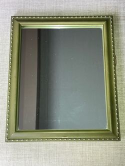 Sage green accent mirror with silver design