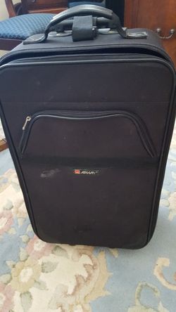 Suitcase fits overhead Zips all around