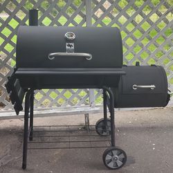 Charcoal grill with offset smoker 