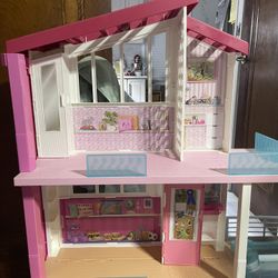 Barbie Dreamhouse Dollhouse with Pool, Slide and Elevator, Plus Lights, Sounds and 70+ Total Accessories, for 3 to 7 Year Olds