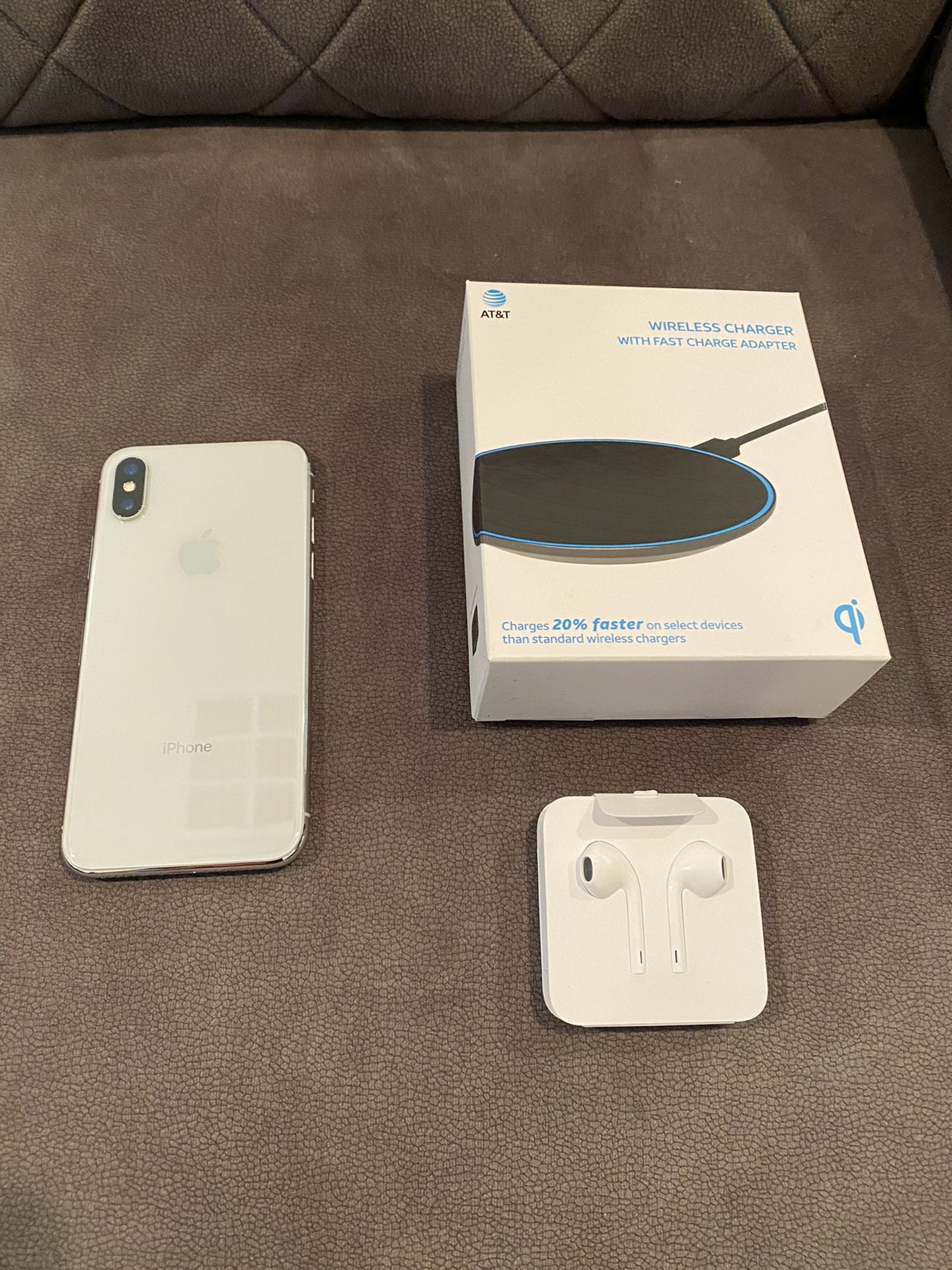 White iPhone X 64GB, AT&T unlocked, brand new fast wireless charging pad, brand new Apple wired headphones (excellent condition)