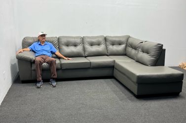 Ashley leather sofa left-arm facing sofa and right-arm facing corner chaise. We deliver & setup.