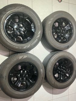 265/65/18. Set a four GM, six lug, black wheel, wheels, tire, tires, tire, pressure sensors and center caps.