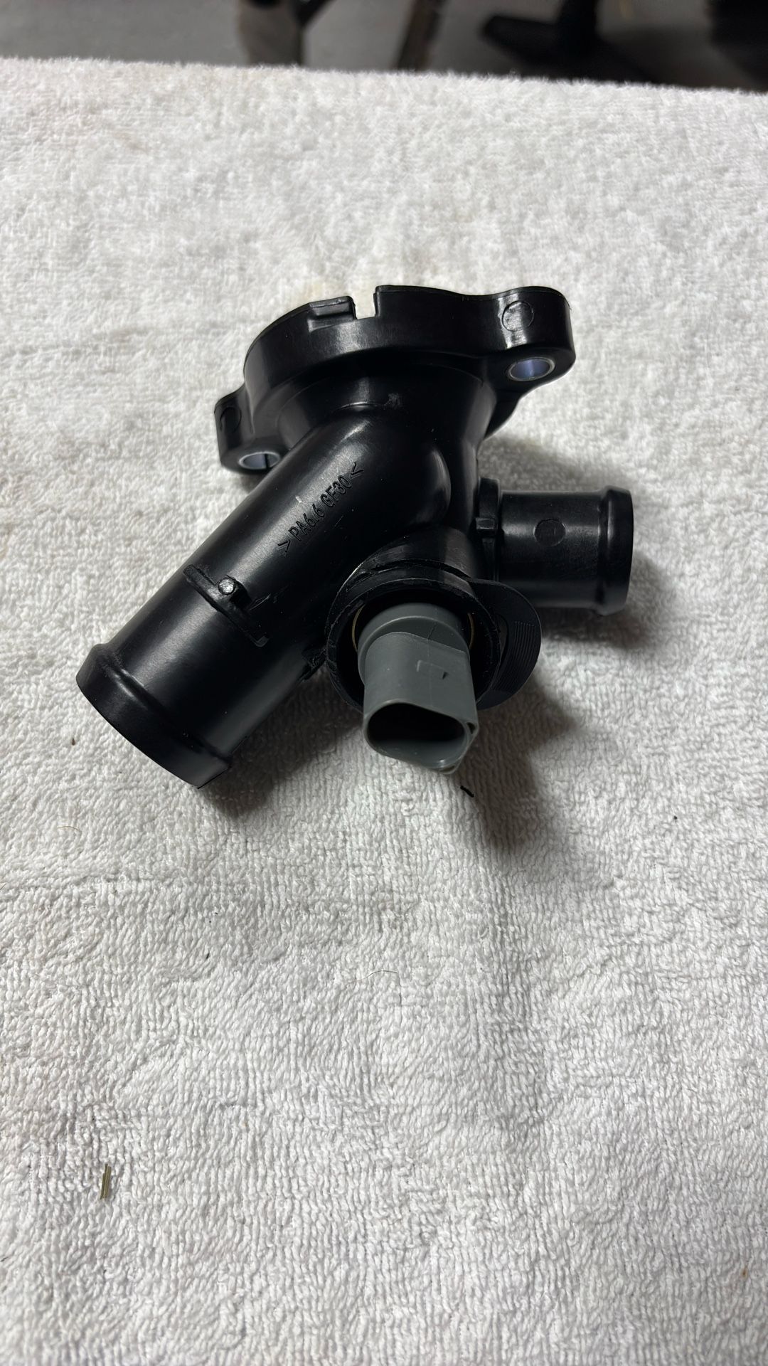 Thermostat housing assembly