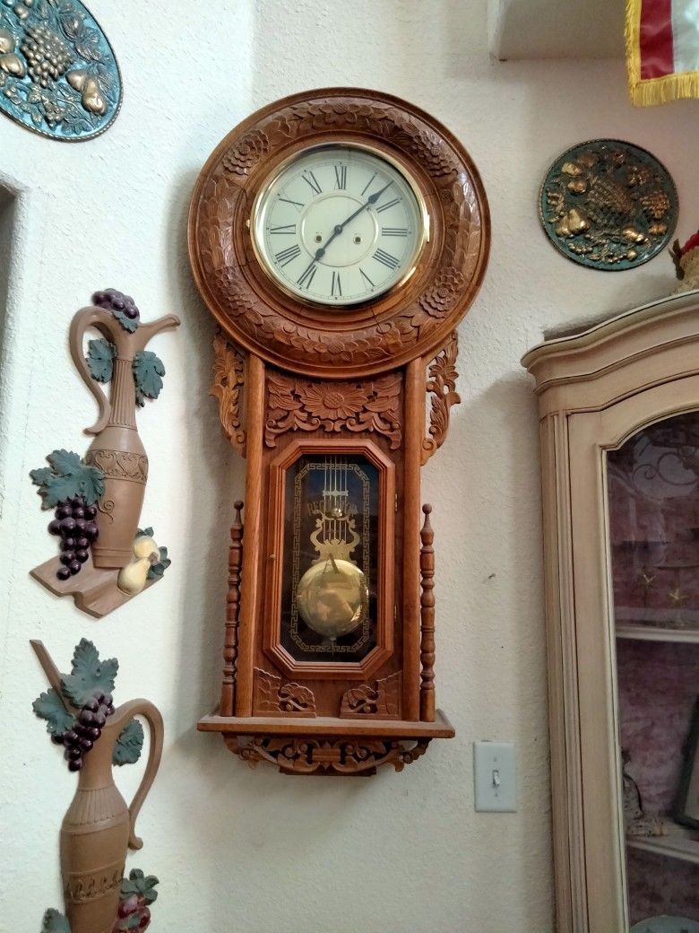 Pendulum Carved Wall Clock