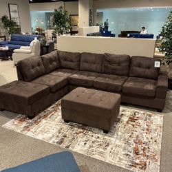 Reversible Sectional With Drop Down Cup Holder