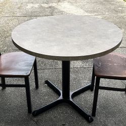 Wooden metal dining table with two chairs