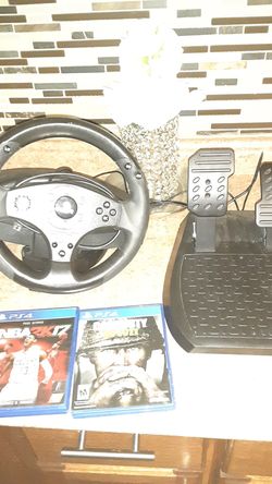 Volante para PlayStation con 2 videojuegos