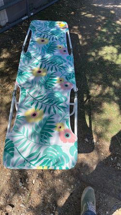 Beach lounger/ camping cot 73 inches long by 22 inches wide and 9 inches high foldable and